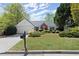 Attractive single-Gathering home boasts a manicured lawn and inviting front entrance, perfect curb appeal at 5755 Haterleigh Dr, Alpharetta, GA 30005