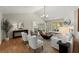 Bright living room features high ceilings, hardwood floors, neutral tones, and a cozy fireplace at 5755 Haterleigh Dr, Alpharetta, GA 30005