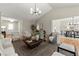Bright living room showcases an open layout, stylish decor, and hardwood flooring at 5755 Haterleigh Dr, Alpharetta, GA 30005