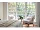 Bright bedroom seating area with large windows at 5755 Haterleigh Dr, Alpharetta, GA 30005