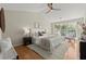 Bedroom with a high ceiling and large windows with views of the exterior at 5755 Haterleigh Dr, Alpharetta, GA 30005