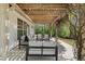 Cozy outdoor patio area with comfortable seating, offering a relaxing space in a serene setting at 5755 Haterleigh Dr, Alpharetta, GA 30005