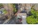 Aerial view of home surrounded by trees and a well-maintained lawn at 97 Spring Leaf Dr, Dallas, GA 30157