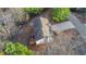 Aerial view of the house with a deck surrounded by lush greenery at 97 Spring Leaf Dr, Dallas, GA 30157
