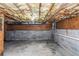 Unfinished basement with concrete floor, exposed ceiling with wood framing at 97 Spring Leaf Dr, Dallas, GA 30157