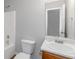 Bright bathroom featuring a large mirror and white vanity with a single sink at 97 Spring Leaf Dr, Dallas, GA 30157