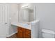 Bright bathroom features a vanity with white countertop, wood cabinets, and a shower at 97 Spring Leaf Dr, Dallas, GA 30157