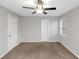 Neutral bedroom featuring a ceiling fan, two closets and neutral color walls and carpeting at 97 Spring Leaf Dr, Dallas, GA 30157