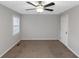 Large bedroom with carpet, ceiling fan, neutral paint and window at 97 Spring Leaf Dr, Dallas, GA 30157