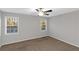 Comfortable bedroom with carpet, ceiling fan, neutral paint and two windows at 97 Spring Leaf Dr, Dallas, GA 30157