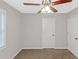 Simple bedroom featuring neutral walls, brown carpet, a ceiling fan, and a window at 97 Spring Leaf Dr, Dallas, GA 30157