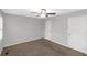 Neutral bedroom featuring a ceiling fan, two closets and neutral color walls and carpeting at 97 Spring Leaf Dr, Dallas, GA 30157