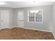 Cozy dining area features a window, chandelier and access to the exterior at 97 Spring Leaf Dr, Dallas, GA 30157