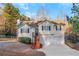 Charming home with a two-car garage, black shutters, wood stairs, and partially fenced front yard at 97 Spring Leaf Dr, Dallas, GA 30157