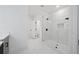 Stylish bathroom with frameless glass shower and modern gray vanity at 2195 Springdale Sw Rd, Atlanta, GA 30315