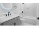 Modern bathroom features a sleek vanity, black hardware, and a shower-tub combo at 2195 Springdale Sw Rd, Atlanta, GA 30315