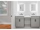 Well-lit bathroom with double vanity, quartz countertop, and modern fixtures at 2195 Springdale Sw Rd, Atlanta, GA 30315