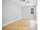 Bright bedroom with beautiful hardwood floors, ceiling fan and large window at 2195 Springdale Sw Rd, Atlanta, GA 30315