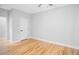 Spacious bedroom with hardwood floors and a white door at 2195 Springdale Sw Rd, Atlanta, GA 30315