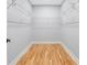 Spacious walk-in closet featuring wood flooring and ample storage with shelving at 2195 Springdale Sw Rd, Atlanta, GA 30315