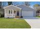 Charming single-story home with well-manicured lawn, covered front porch, and attached garage at 2195 Springdale Sw Rd, Atlanta, GA 30315