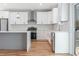 Modern kitchen with quartz countertops, stainless steel appliances, and white cabinetry at 2195 Springdale Sw Rd, Atlanta, GA 30315
