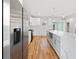 Bright kitchen features a waterfall island, stainless steel appliances, and hardwood flooring at 2195 Springdale Sw Rd, Atlanta, GA 30315