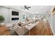 Open-concept living room with hardwood floors, a modern fireplace, and plenty of natural light at 2195 Springdale Sw Rd, Atlanta, GA 30315