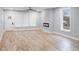 Bright living room featuring hardwood floors, a modern fireplace, and large windows for natural light at 2195 Springdale Sw Rd, Atlanta, GA 30315