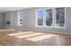 Bright living room with hardwood floors, modern fireplace, and large windows for natural light at 2195 Springdale Sw Rd, Atlanta, GA 30315
