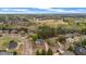 Scenic aerial view of a beautiful neighborhood with tree-lined streets, well-manicured lawns, and a golf course at 5204 Heron Bay Blvd, Locust Grove, GA 30248