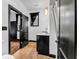 Bathroom showcasing a dark vanity with a light countertop, a tiled floor and black trim at 5204 Heron Bay Blvd, Locust Grove, GA 30248