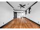 Airy bedroom with beautiful hardwood floors, ceiling fan and neutral color palette at 5204 Heron Bay Blvd, Locust Grove, GA 30248