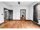 Bedroom with hardwood floors, dark trim and doors and an entry way to the bathroom at 5204 Heron Bay Blvd, Locust Grove, GA 30248