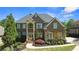 Beautiful brick home with well-manicured landscaping and a classic architectural design at 5204 Heron Bay Blvd, Locust Grove, GA 30248