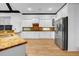 Well-equipped kitchen with granite countertops, stainless steel appliances, and ample storage at 5204 Heron Bay Blvd, Locust Grove, GA 30248