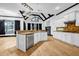 Stylish kitchen with stainless steel appliances, island, and black trim at 5204 Heron Bay Blvd, Locust Grove, GA 30248