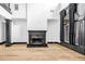 Bright living room with a fireplace and large windows at 5204 Heron Bay Blvd, Locust Grove, GA 30248