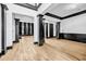Spacious living room with hardwood floors, black trim, and natural light at 5204 Heron Bay Blvd, Locust Grove, GA 30248