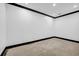 Room featuring white walls, concrete floors, black trim, and recessed lighting at 5204 Heron Bay Blvd, Locust Grove, GA 30248