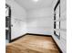 Spacious walk-in closet featuring wire shelving and hardwood flooring for ample storage and organization at 5204 Heron Bay Blvd, Locust Grove, GA 30248
