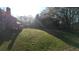 Spacious backyard featuring a wooden deck and plenty of green space, perfect for outdoor enjoyment at 5254 Franklin Goldmine Rd, Cumming, GA 30028