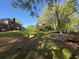 Lush backyard featuring a well-maintained lawn, a deck, and mature trees for privacy at 5254 Franklin Goldmine Rd, Cumming, GA 30028