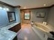 Relaxing main bathroom with a marble vanity, jacuzzi tub, shower, and calming blue walls at 5254 Franklin Goldmine Rd, Cumming, GA 30028