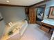 Elegant bathroom featuring a luxurious soaking tub and wood trim at 5254 Franklin Goldmine Rd, Cumming, GA 30028