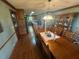 Dining room with hardwood floors connected to the well-lit and renovated kitchen at 5254 Franklin Goldmine Rd, Cumming, GA 30028