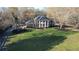 Stunning exterior elevation view of home, showing a lush front yard and circular driveway at 5254 Franklin Goldmine Rd, Cumming, GA 30028