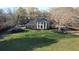 Beautiful home with a large front yard, circular driveway, and classic architectural details at 5254 Franklin Goldmine Rd, Cumming, GA 30028