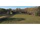 Expansive property with a brick home, fenced pasture, and mature trees providing a serene, country-like setting at 5254 Franklin Goldmine Rd, Cumming, GA 30028