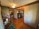 Inviting foyer with hardwood floors, decorative lighting, and staircase leading to other living spaces at 5254 Franklin Goldmine Rd, Cumming, GA 30028